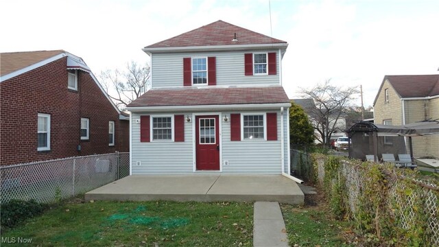 128 Columbia, Chester, WV 26034 - view of front of property featuring a patio and a fenced backyard