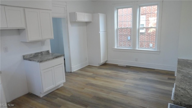 128 Columbia, Chester, WV 26034 - unfurnished dining area featuring light wood-type flooring