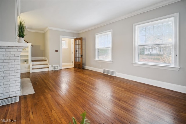 unfurnished living room with dark hardwood / wood-style floors and crown molding