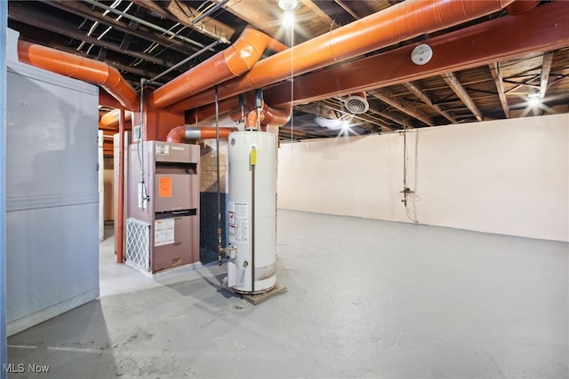 basement featuring water heater and heating unit