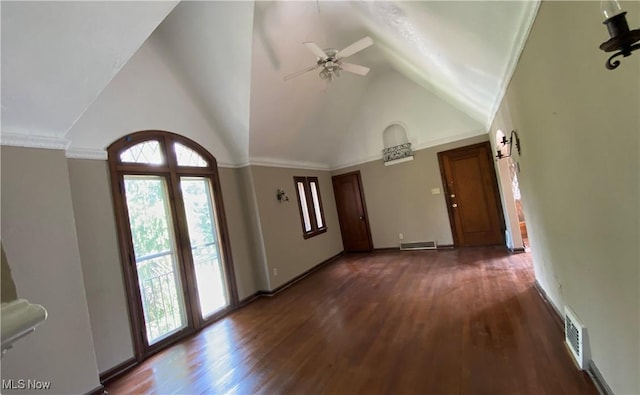 foyer entrance featuring ceiling fan, dark hardwood / wood-style flooring, high vaulted ceiling, and crown molding