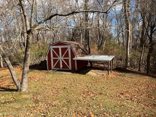 view of outbuilding with a lawn