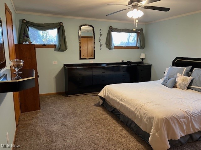 bedroom with light colored carpet, ceiling fan, and crown molding