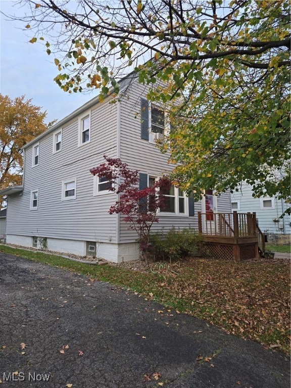 view of home's exterior featuring a deck