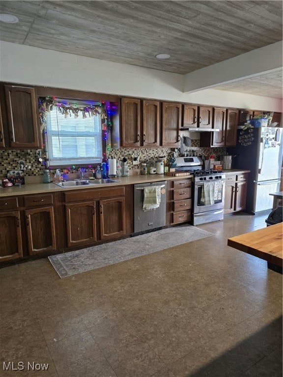 kitchen featuring tasteful backsplash, sink, a healthy amount of sunlight, and stainless steel appliances