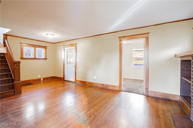 unfurnished living room with hardwood / wood-style floors