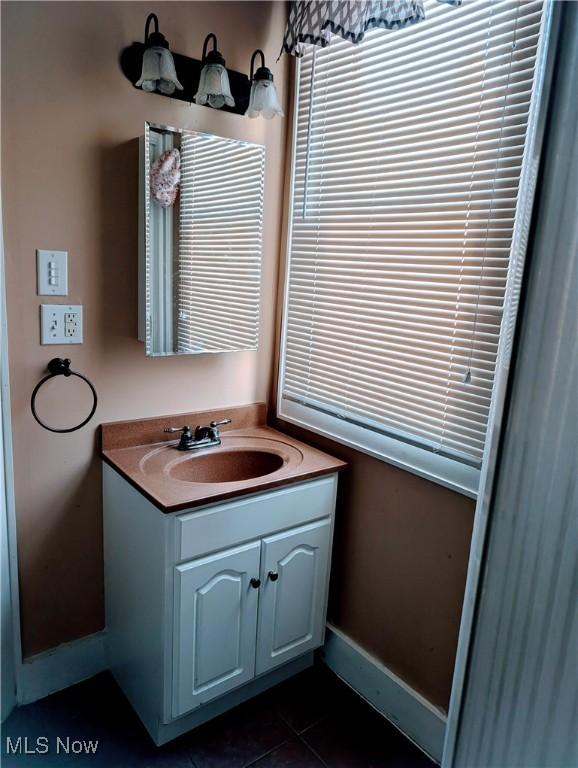 bathroom with tile patterned flooring and vanity