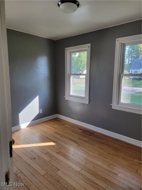 spare room with light wood-type flooring