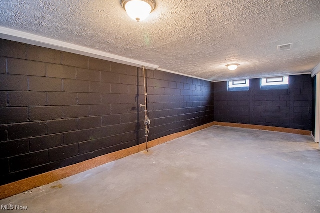 basement featuring a textured ceiling