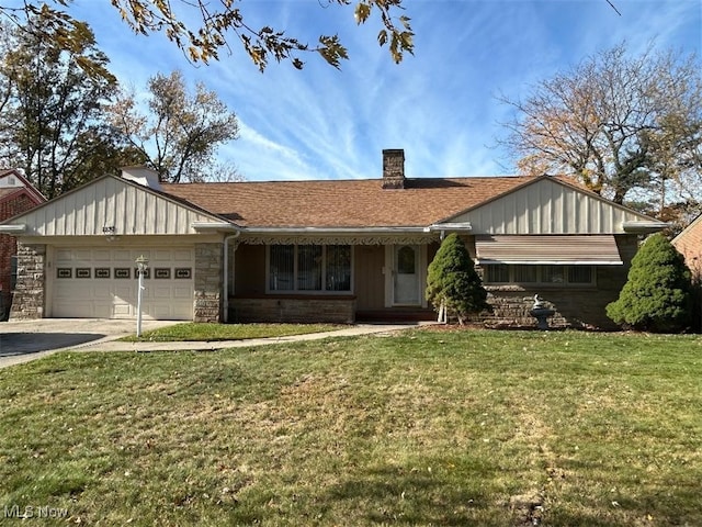 ranch-style home featuring a garage and a front yard