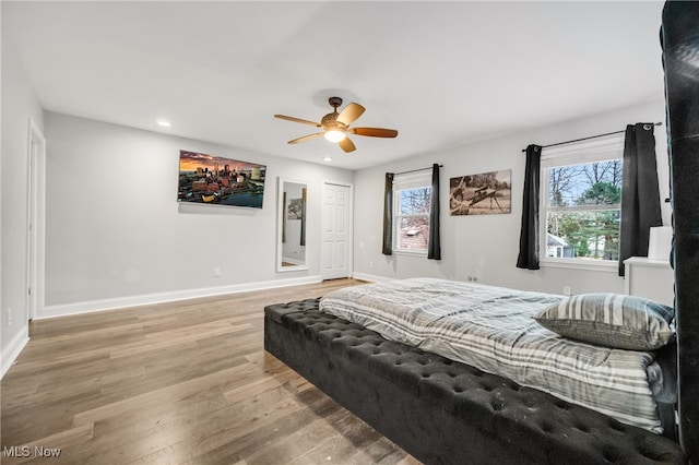 bedroom featuring ceiling fan and wood-type flooring