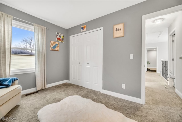 carpeted bedroom with a closet