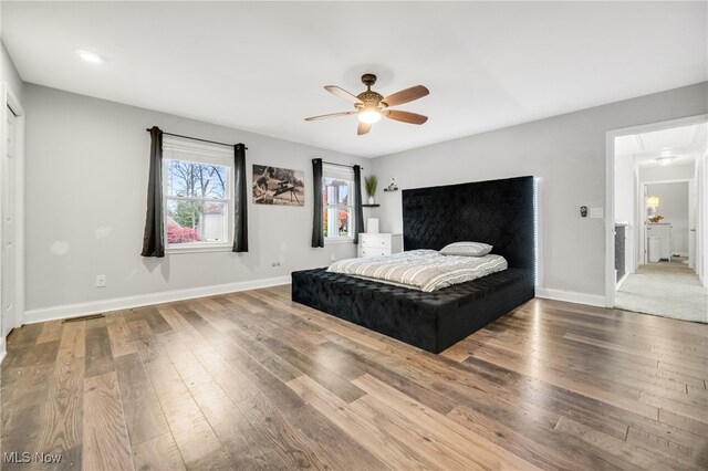 bedroom featuring hardwood / wood-style flooring and ceiling fan