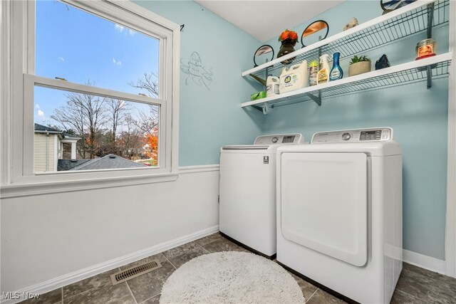 laundry room with independent washer and dryer