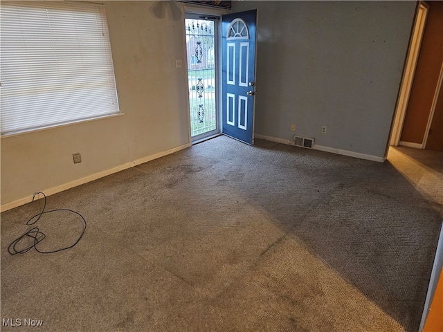 interior space with dark colored carpet