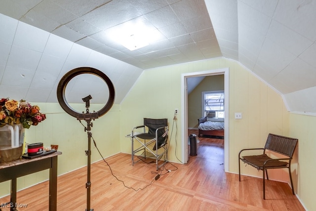 bonus room with hardwood / wood-style floors and lofted ceiling