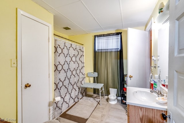 bathroom with curtained shower and vanity