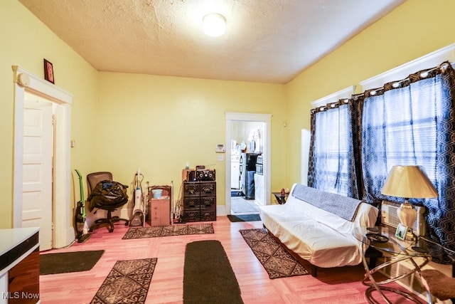 sitting room featuring hardwood / wood-style floors and a textured ceiling