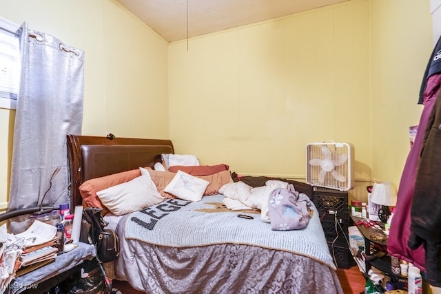 bedroom featuring a textured ceiling and hardwood / wood-style flooring