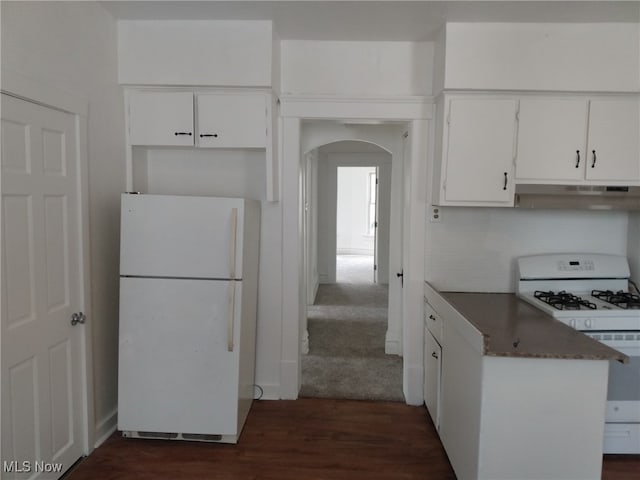 kitchen featuring white cabinets, white appliances, and dark hardwood / wood-style flooring