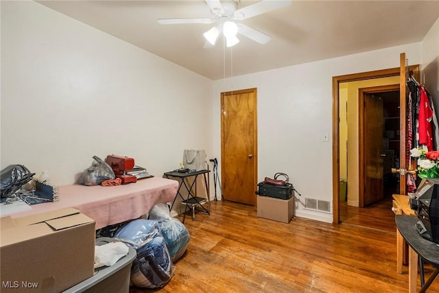 bedroom featuring hardwood / wood-style flooring and ceiling fan