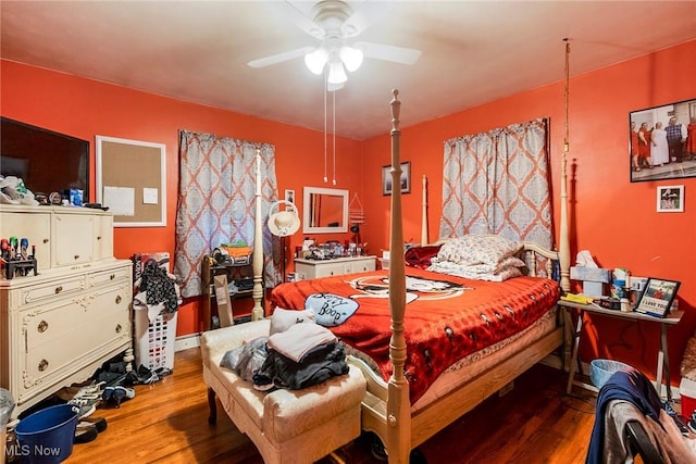 bedroom with hardwood / wood-style floors and ceiling fan