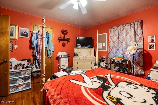 bedroom with ceiling fan and wood-type flooring