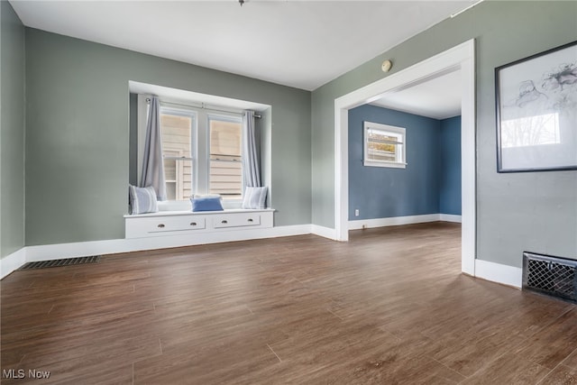 spare room featuring dark hardwood / wood-style flooring