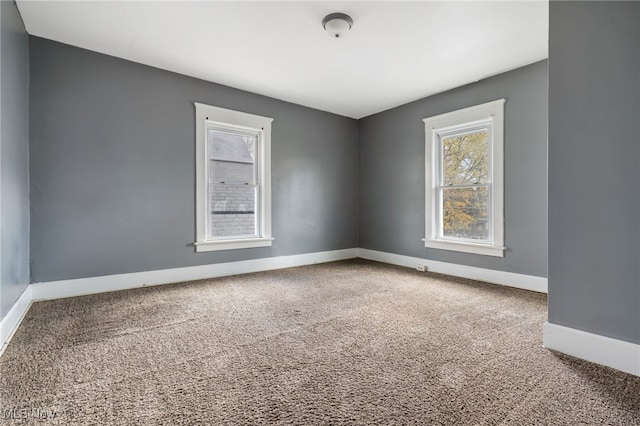 unfurnished room with carpet flooring