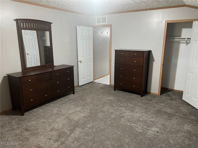 unfurnished bedroom featuring a closet, carpet, a textured ceiling, and lofted ceiling