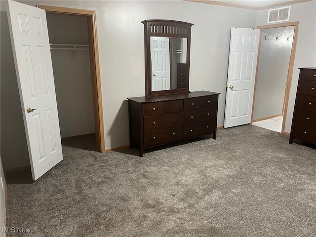 bedroom with a closet and carpet floors