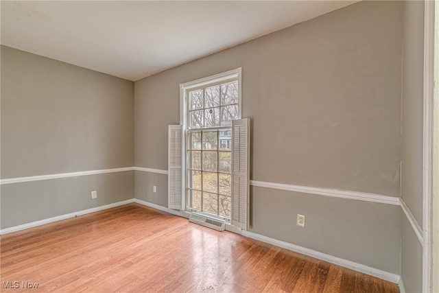 empty room featuring hardwood / wood-style flooring