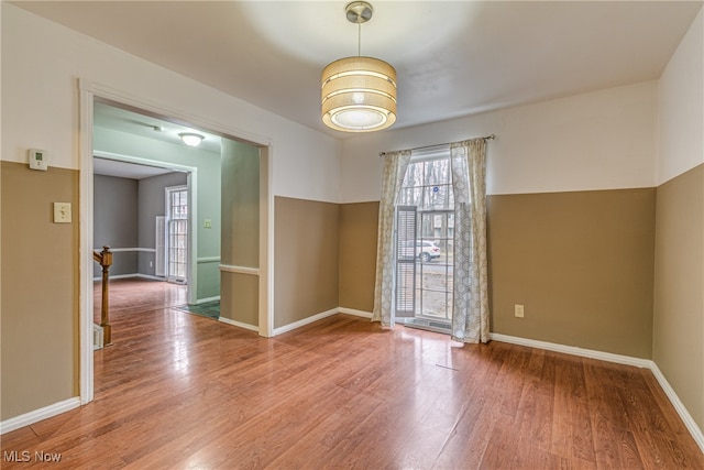 unfurnished room with hardwood / wood-style floors