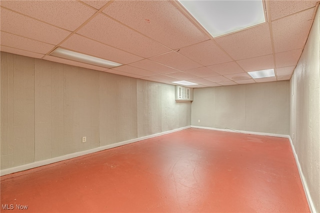 basement featuring a paneled ceiling