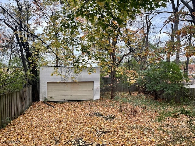 view of yard with a garage and an outdoor structure