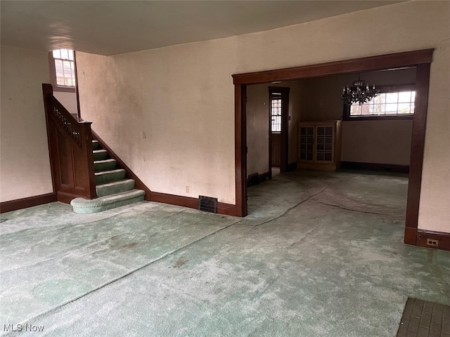 interior space featuring plenty of natural light and a notable chandelier