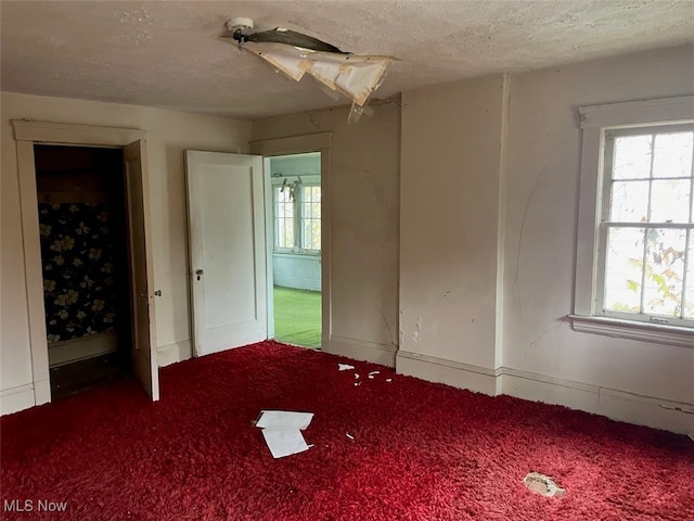 unfurnished bedroom featuring a textured ceiling