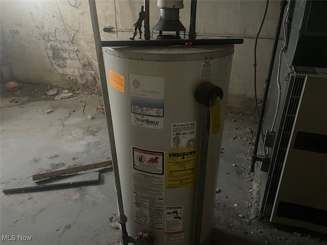 utility room with gas water heater