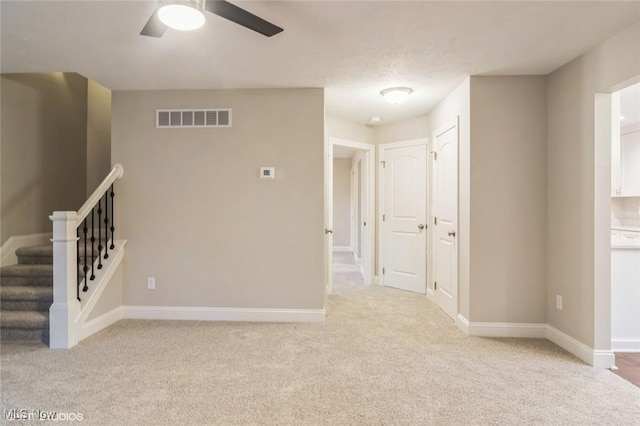 1064 Bryce Ave, Aurora, OH 44202 - empty room with light carpet, ceiling fan, and baseboards
