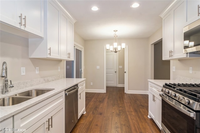 kitchen with white cabinets, sink, dark wood-type flooring, and appliances with stainless steel finishes