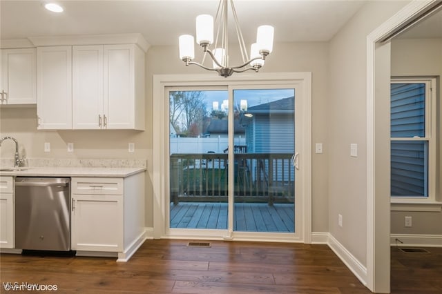 kitchen with white cabinetry, sink, decorative light fixtures, stainless steel dishwasher, and dark wood-type flooring