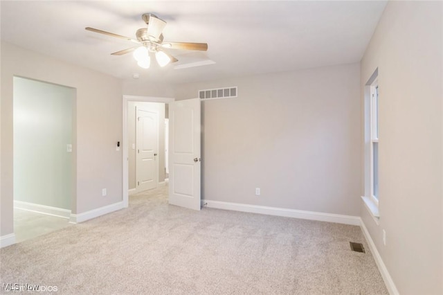 1064 Bryce Ave, Aurora, OH 44202 - unfurnished bedroom with light colored carpet, ceiling fan, and baseboards