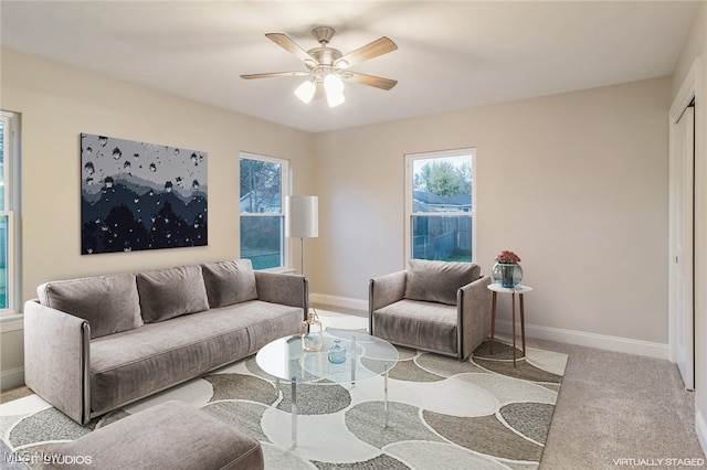 living room featuring light carpet and ceiling fan