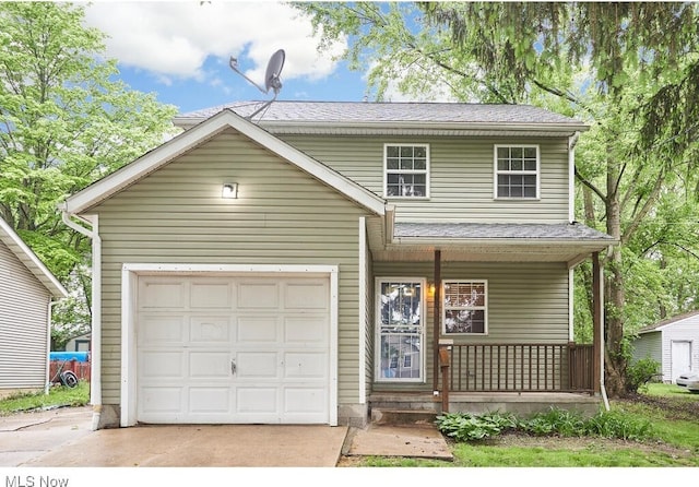 front of property with a garage and covered porch