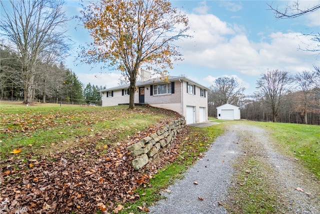 exterior space with a garage and a yard