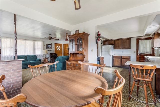 dining room with sink and ceiling fan