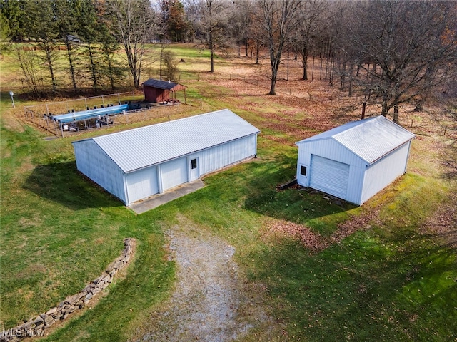 birds eye view of property with a rural view