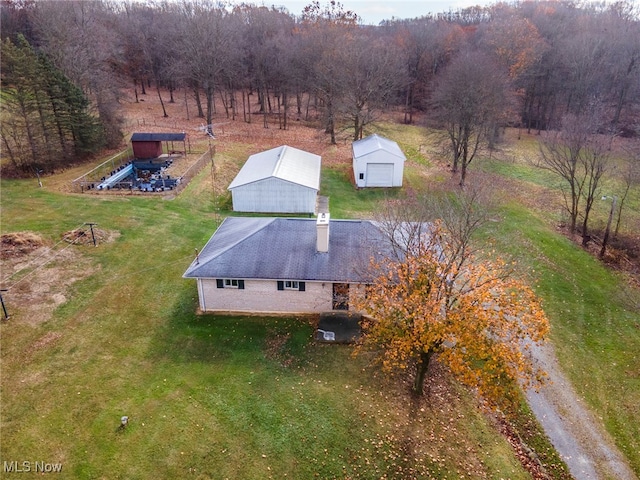 birds eye view of property with a rural view