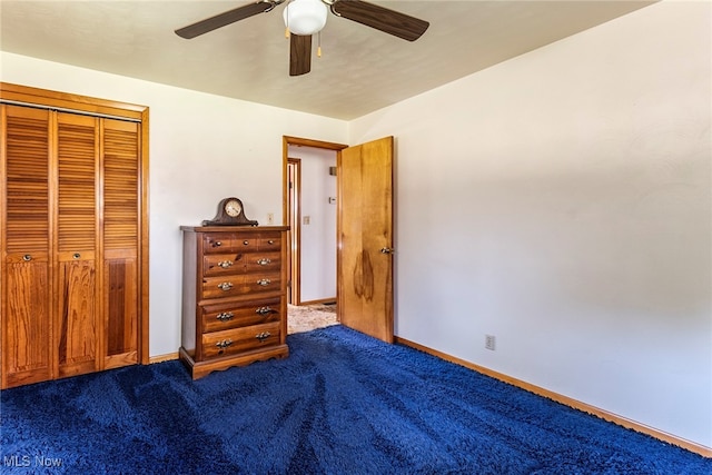 unfurnished bedroom with ceiling fan, a closet, and carpet