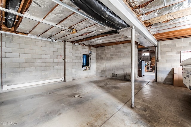 basement featuring a baseboard heating unit